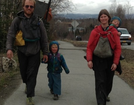 Ground Truth Trekkers Erin and Hig walking with son Katmai and daughter Lituya getting a ride